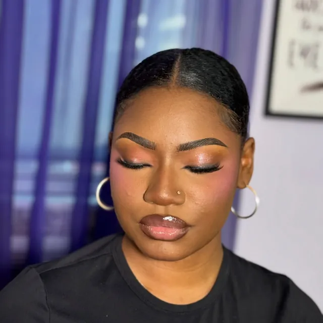 Soft glam makeup, eyes closed, at the Queens studio
