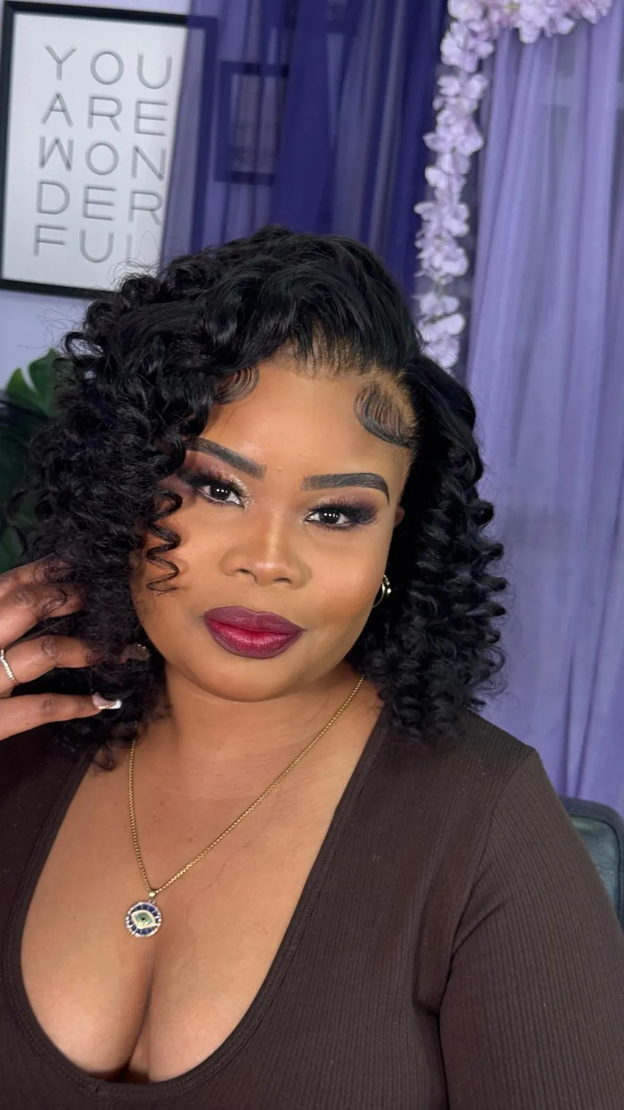 Defined curls with a bold red lip, makeup by Tyca Beaute